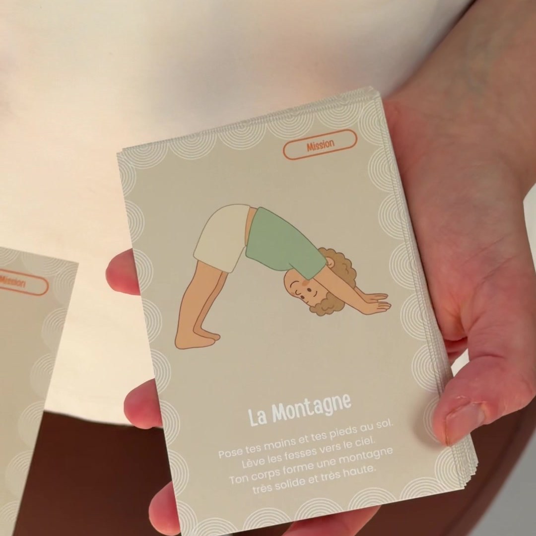 A Kideo yoga card in hand: Mountain Pose