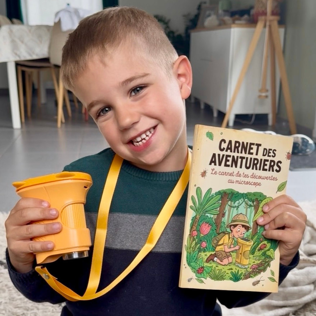 Child exploring with portable digital microscope